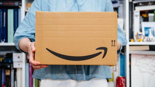 woman holding an amazon prime box - amazon prime day deals
