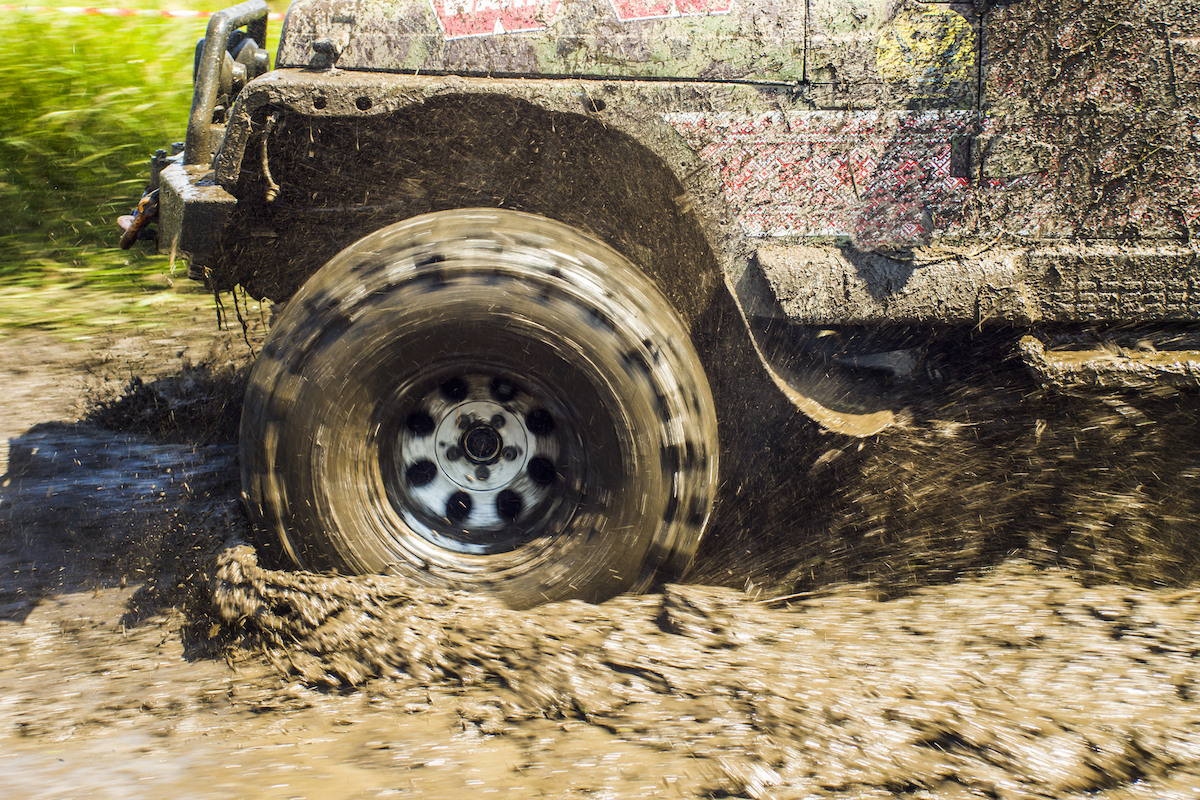 Truck driving through mud