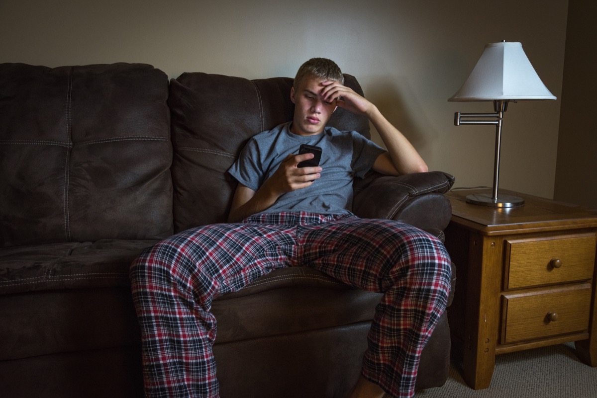 white teenage boy on couch