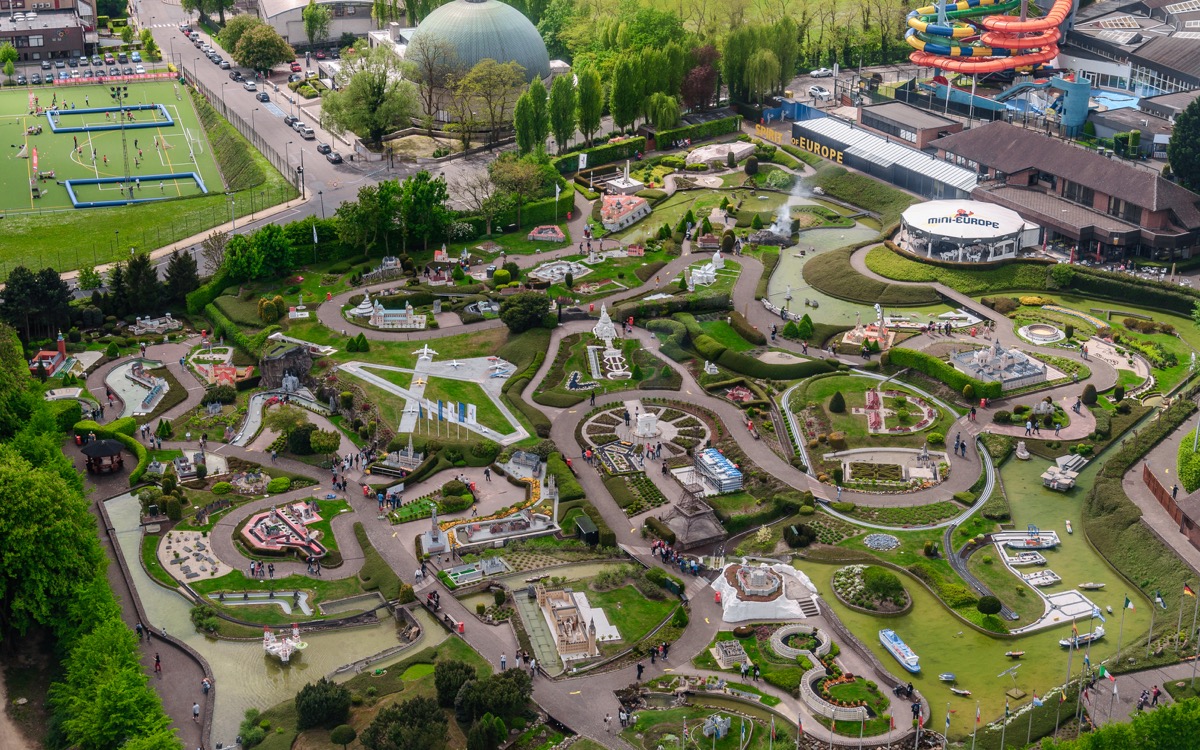 Panoramic view from the observation deck on the top level of the Atomium - the green trees, modern and historic buildings, and miniature Park "Mini Europe"