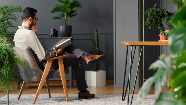 Man with plants in home