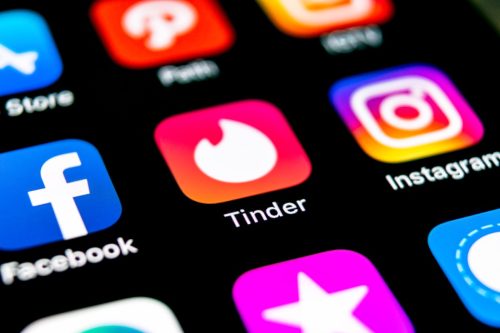 tinder app on a phone screen