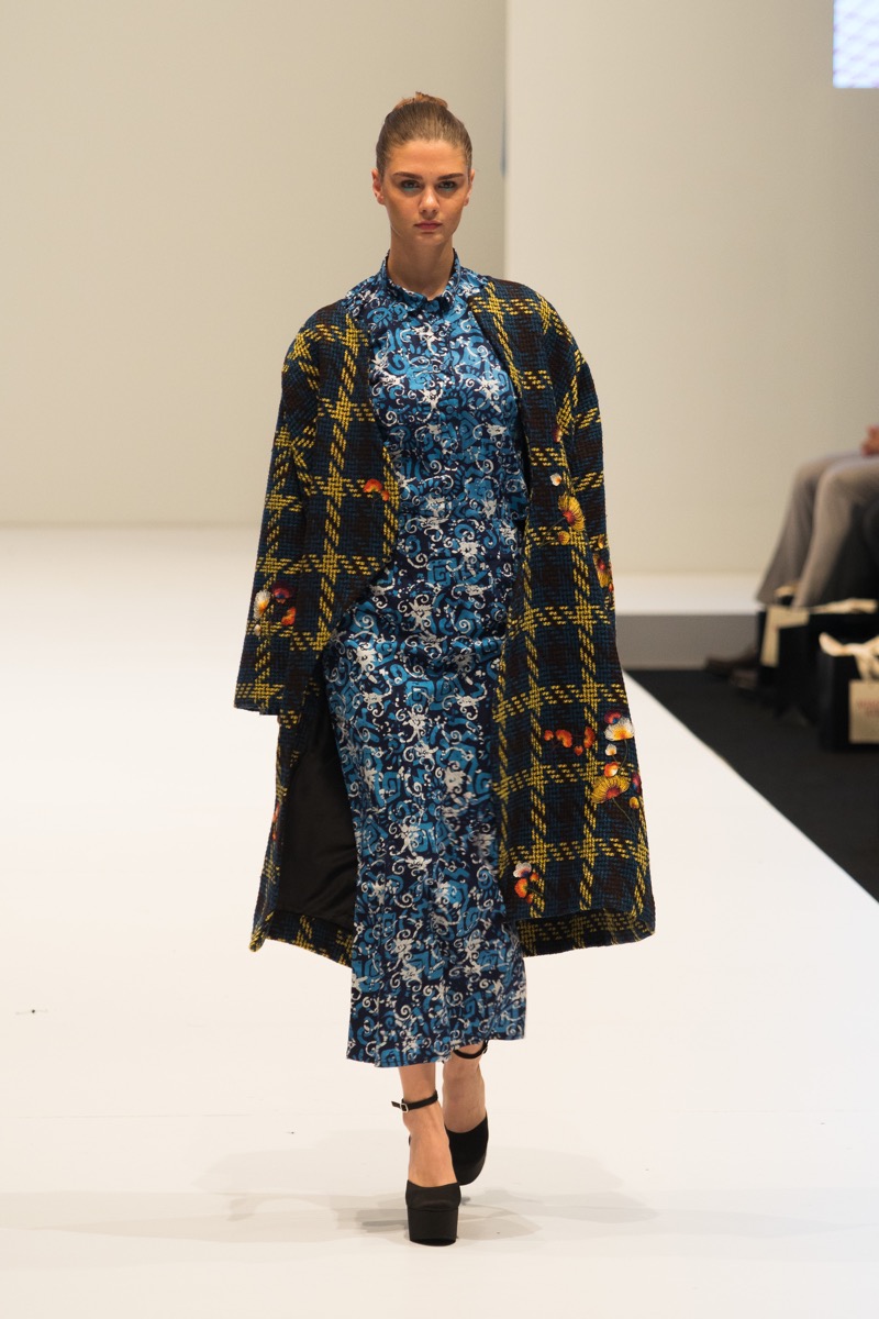 Kuala Lumpur, Malaysia - August 8, 2018 ; Model walks on white catwalk in Fashion Show of Autumn / Winter KL Fashion Week 2018 in "Ready to Wear" Multi brand at Pavilion Department Store - Image