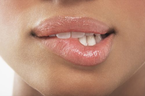 Woman biting her lip