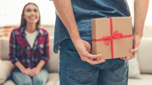 man giving a woman a valentine's day present