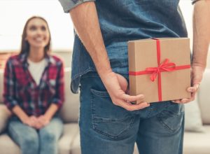 man giving a woman a valentine's day present