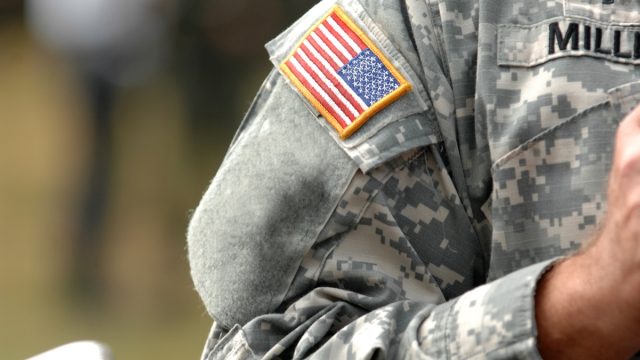 the american flag patch on a military uniform