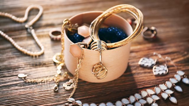 old jewelry on a wooden attic floor things to throw away