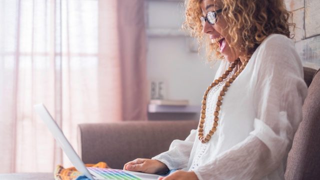 woman reading a computer
