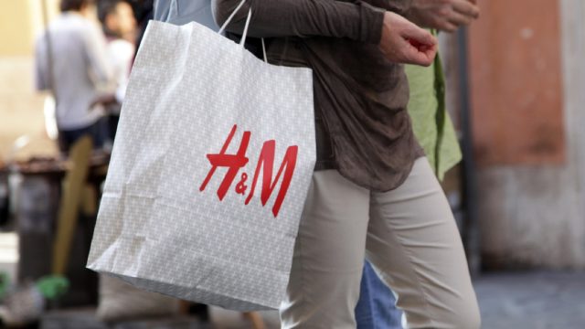 close up of h&m bag being carried by a man