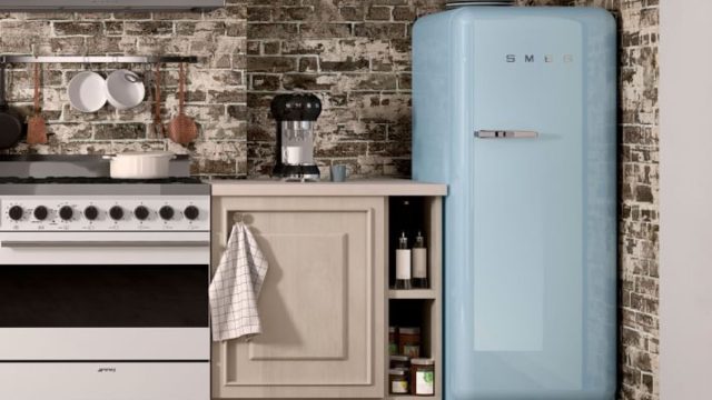 product shot of a baby blue full-size SMEG fridge in a rustic kitchen