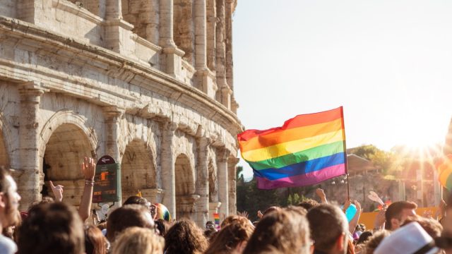 People Holding a Gay Pride Flag How to Support the LGBT Community stereotypes about the LGBTQ community