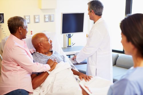 patient and doctor looking at test results, heart risk factors