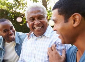 father laughing with his sons, smart person habits