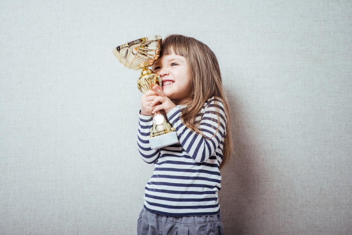 little girl holding trophy, bad parenting advice
