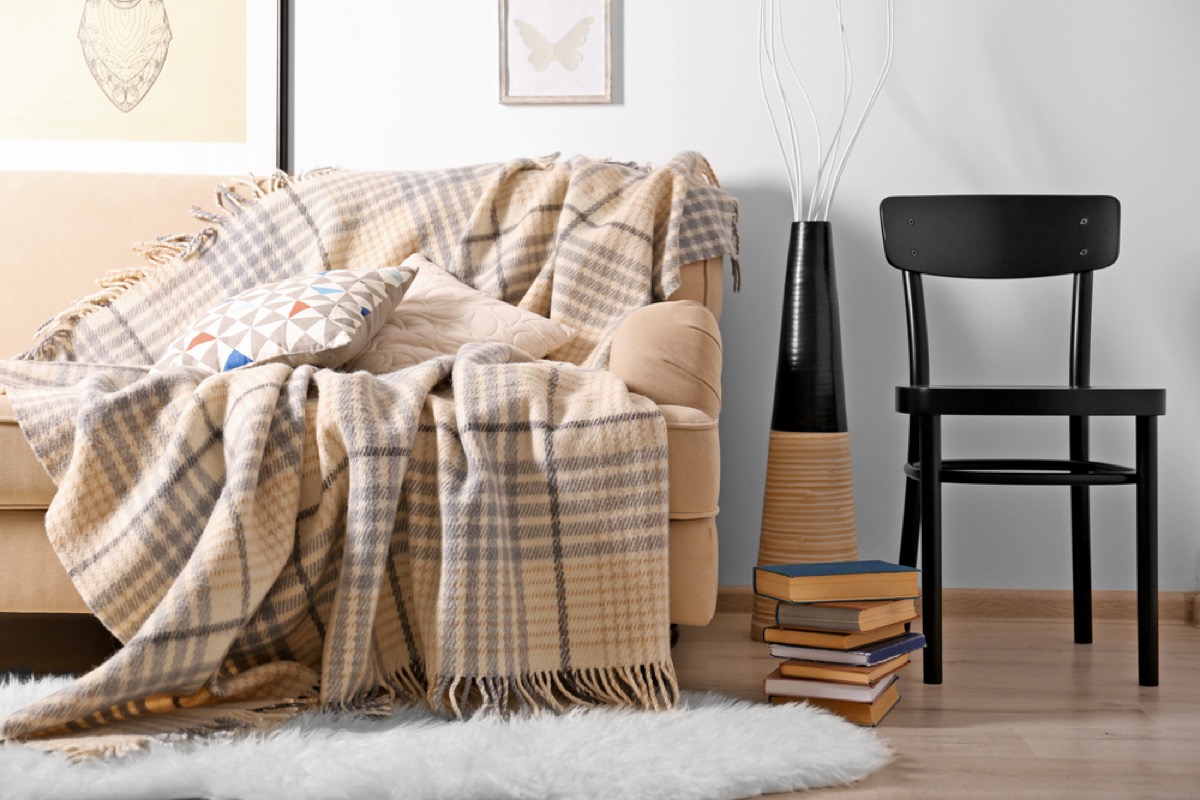 plaid blanket on couch, things housekeepers hate