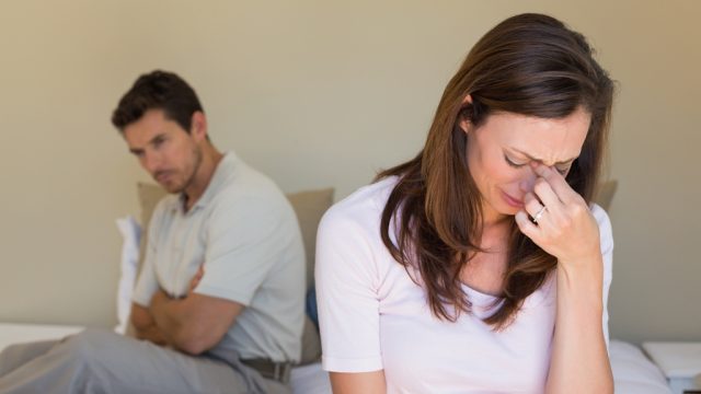 married woman crying during an argument with her husband about cheating