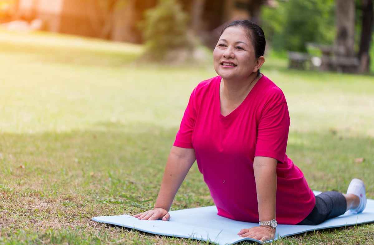woman doing yoga, smart person habits
