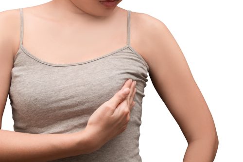 woman holding her breast