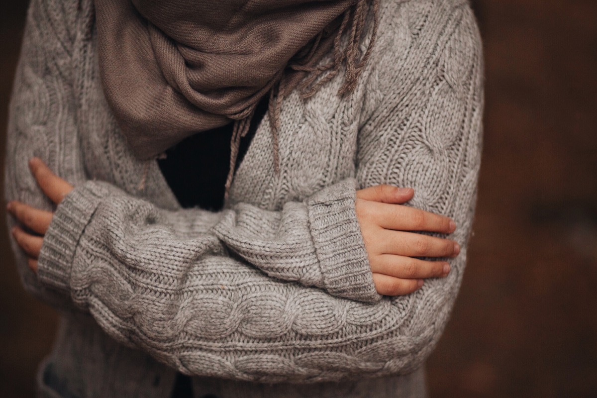 woman whose cold crossing her arms