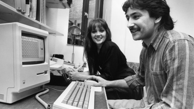 Yvonne Robertson and Nairish Nash at an apple ii computer in the 1980s