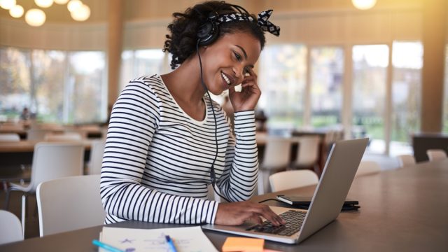College Student Studying on a Laptop Ways College is Different