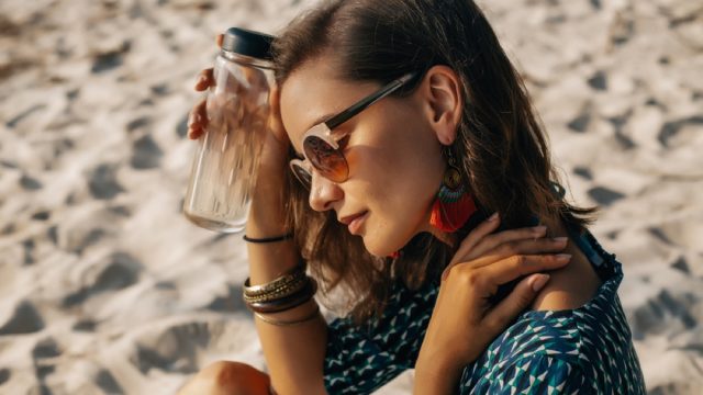 woman on beach in warm weather, cooling products