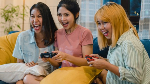 Asian Women Playing Video Games