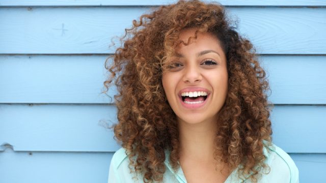 happy black woman outside, ways to feel amazing