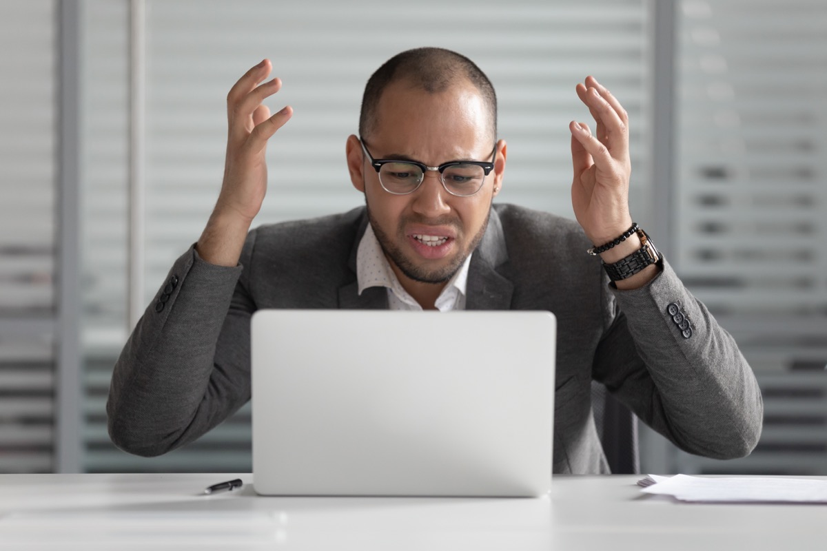 man angry at laptop