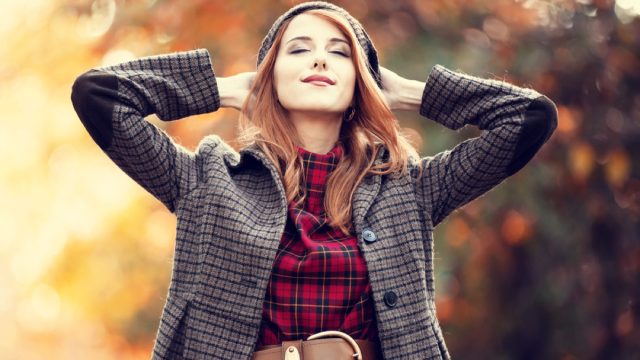 woman in red dress standing outside in autumn, fall dresses