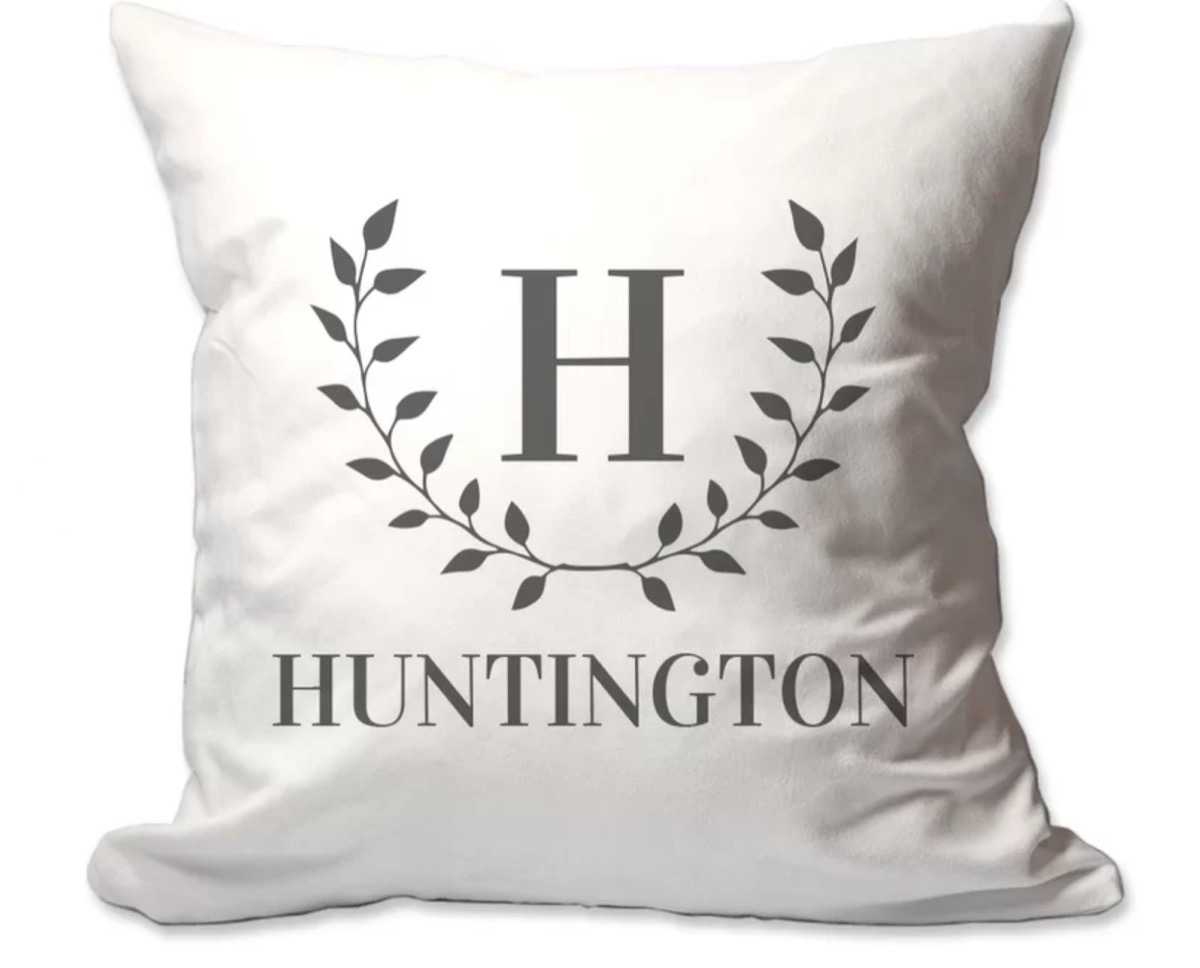 white pillow with "huntington" and the letter H in ivy wreath, hanukkah gifts