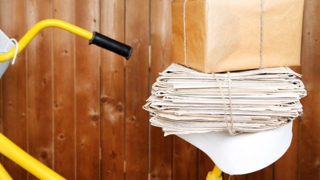 newspapers on the back of a bike, paper route