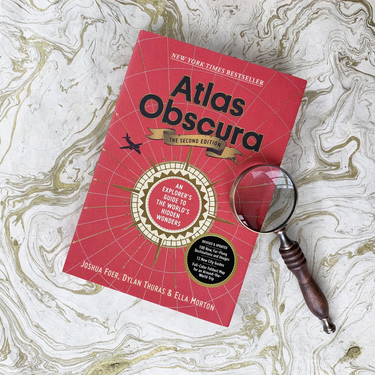 Travel book with magnifying glass