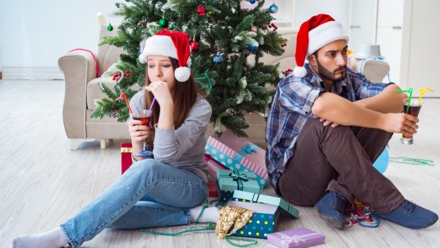 couple arguing and looking upset on Christmas