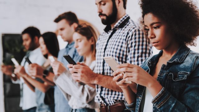 young people in a line on the phone