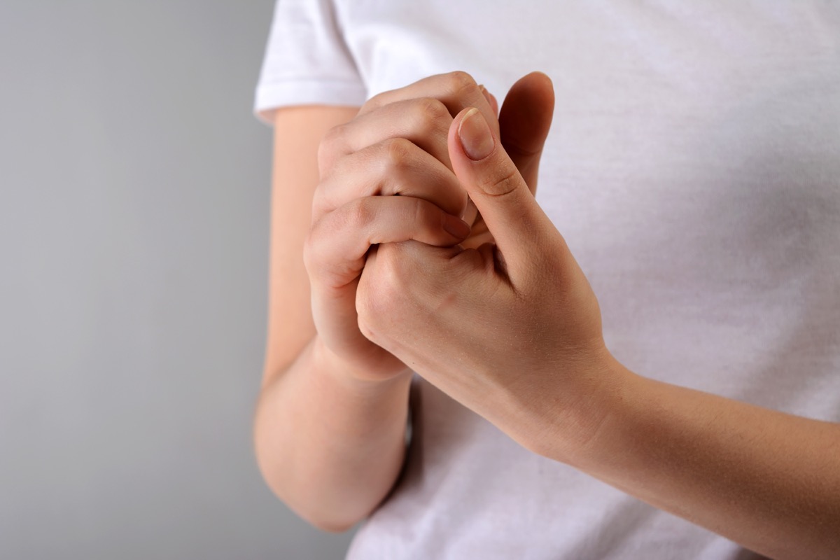 closeup of a person rubbing their fingers