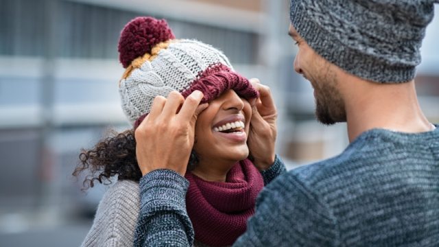 young couple laughing in the winter
