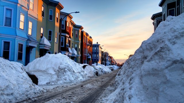 Large snowbanks in the South Boston Southie neighborhood of Boston. Boston is the largest city in New England, the capital of the state of Massachusetts.