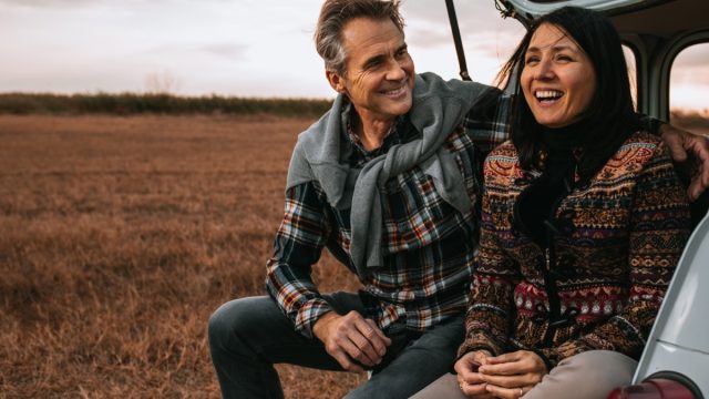 man surprising his wife with a outdoor sunrise trip