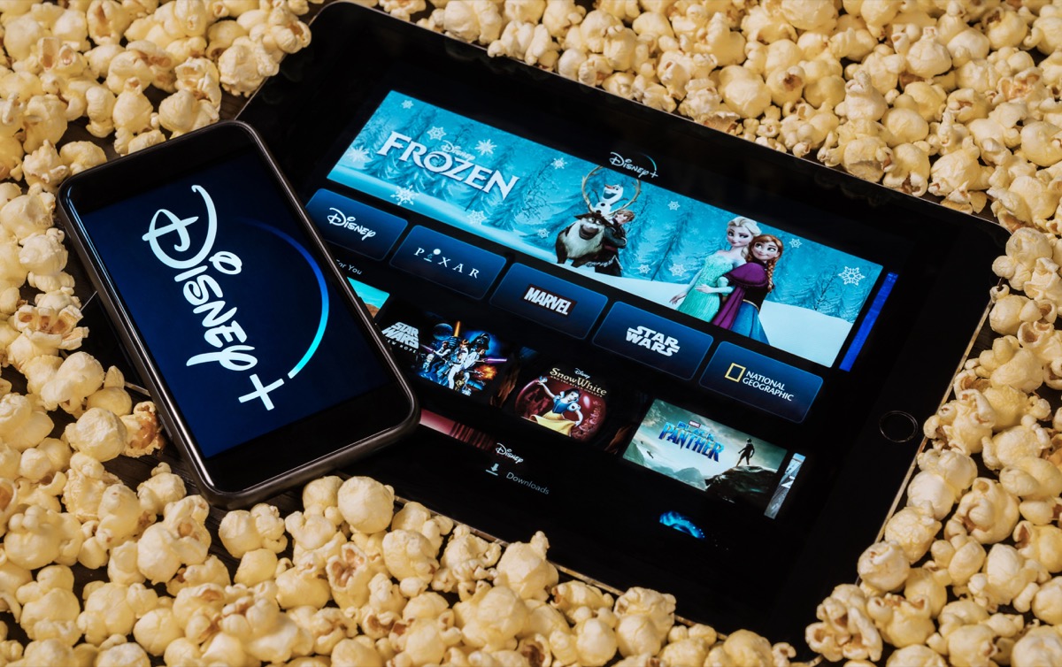 disney plus on tablet surrounded by popcorn