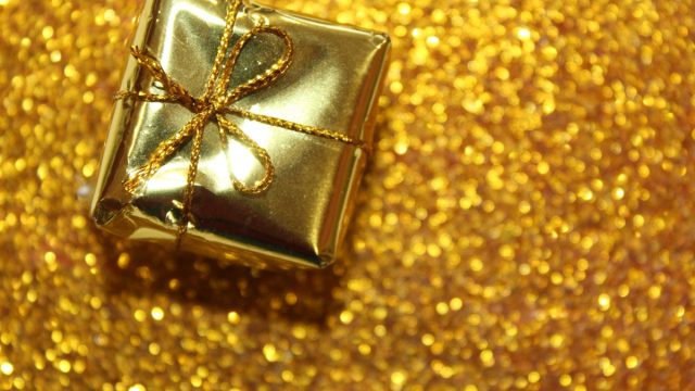 gold christmas gift on gold background