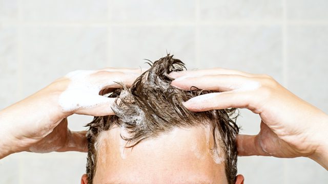 man washing his hair