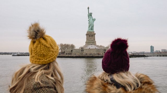 two girls in front of the new york city
