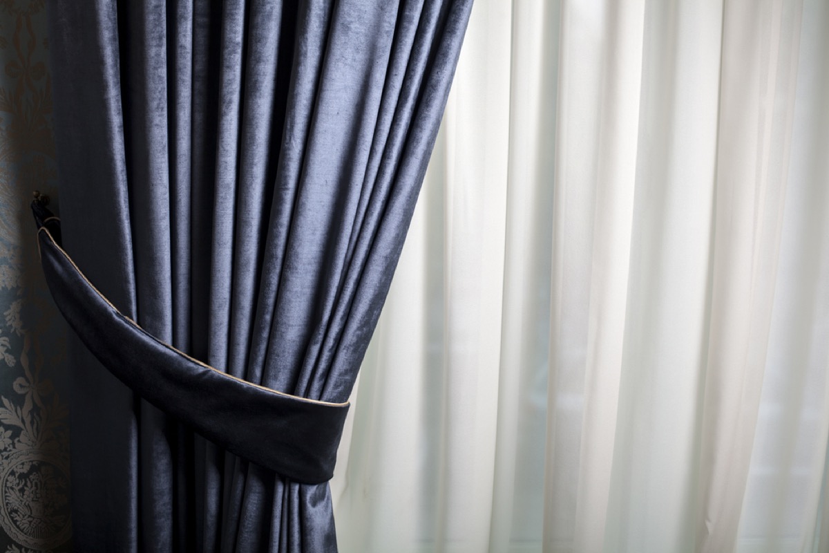 blue velvet curtain on window
