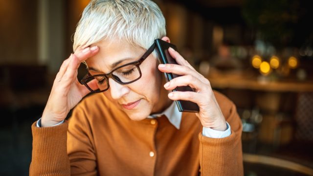 woman stressed out while she's on the phone