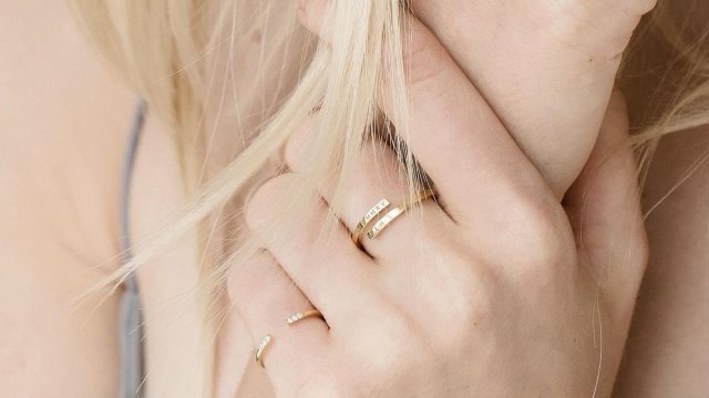 Blonde woman wearing wrap name ring