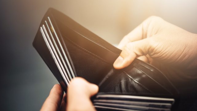 man showing empty wallet