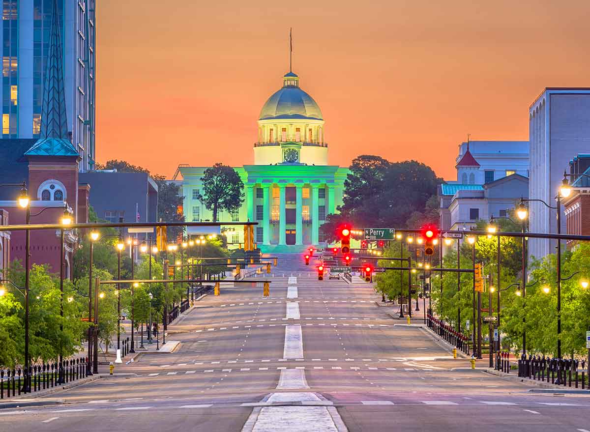 a street at dusk leading to the capitol building in montgomery
