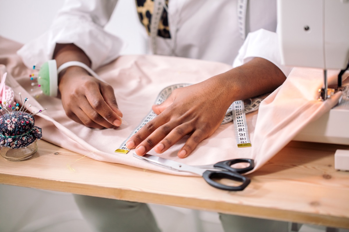 Woman measuring fabric
